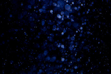 Glittering stars of blue bokeh