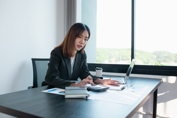 Working from home thailand Coronavirus lockdown self isolation. young Woman in her thirties working from home with a laptop,	