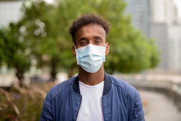 African man wearing face mask to protect against corona virus