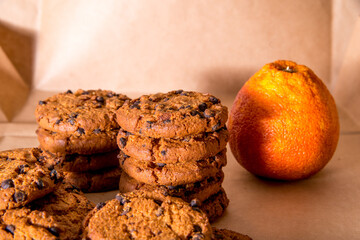 Cookies with chocolate icing, orange, on a white and black background, copy space, template