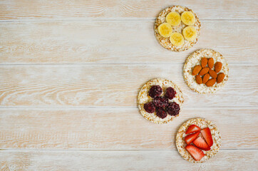 cereal breakfast crisp breads with strawberries, almonds nuts, banana fruit and blackberries