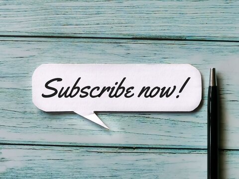Phrase Subscribe now on bubble speech with a pen.