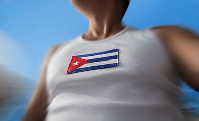 The national flag of Cuba on the athlete's chest