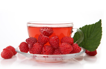 tea with raspberries on a white background