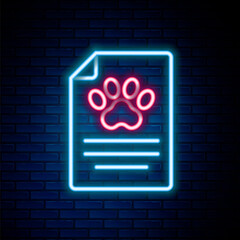 Glowing neon line Clipboard with medical clinical record pet icon isolated on brick wall background. Health insurance form. Medical check marks report. Colorful outline concept. Vector