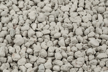 White pebbles background texture. Rock background. clay pebbles