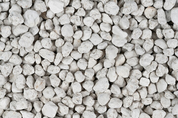 White pebbles background texture. Rock background. clay pebbles