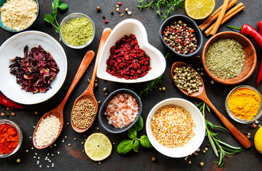 Various spices in a bowls on a black