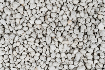 White pebbles background texture. Rock background. clay pebbles
