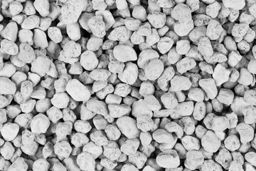 White pebbles background texture. Rock background. clay pebbles