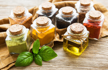 Jars with dried herbs, spices on the table