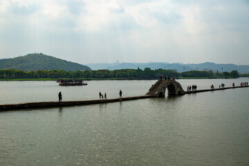 A bridge over the dyke in the middle of the lake