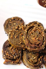 Alu Vadi, Patra, paatra, colocasia leaves roll, Patrode is a popular Indian healthy steamed snack. Garnished with sesame and mustard seeds. served with tamarind chutney. copy space.