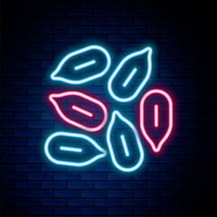 Glowing neon line Seeds of a specific plant icon isolated on brick wall background. Colorful outline concept. Vector