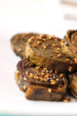Alu Vadi, Patra, paatra, colocasia leaves roll, Patrode is a popular Indian healthy steamed snack. Garnished with sesame and mustard seeds. served with tamarind chutney. copy space.