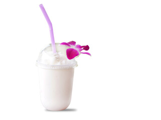 Coconut water in a clear plastic glass with purple straws decorated with purple orchids. On a white background