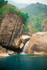 A serene waterfall and a lagoon on the way to rainbow falls in Meghalaya.