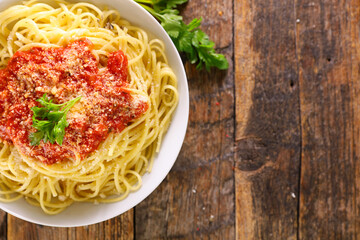 spaghetti with tomato sauce and parmesan
