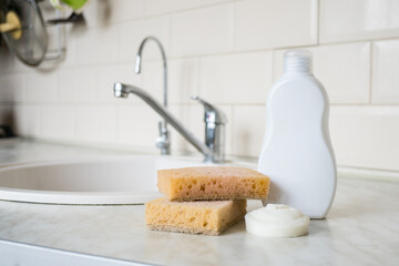 Zero waste products for personal care. Eco friendly natural bamboo sponge under the kitchen. Washing dishes. Hand washing