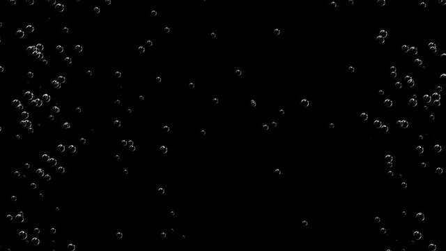 The camera observes a smooth, slow rise of air bubbles against a black background.