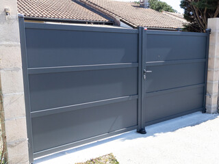 Aluminium door modern home gray steel gate portal of suburb house