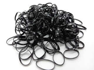 black colored rubber hairband on white background - Powered by Adobe
