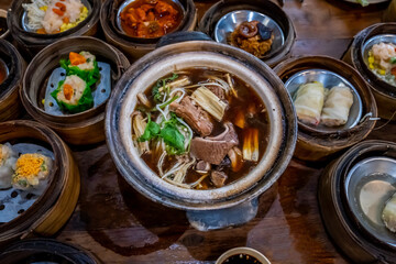 Bak Kut Teh food menu of slow cooked pork with Chinese herbs surrounded by various type of dimsum