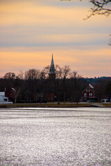 town across water at dusk