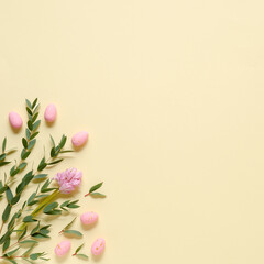 Fototapeta na wymiar Pink eggs, hyacinth and eucalyptus on yellow background
