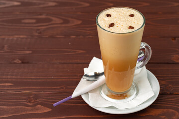 Cup of hot coffee latte on table