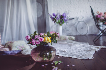 Beautiful still life with a vase and flowers, retro style, photo studio