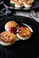cheesecakes with strawberry jam on a plate