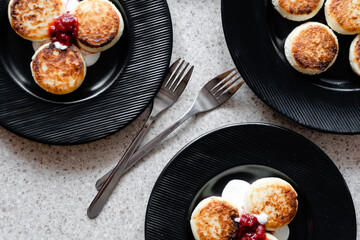 cheesecakes with strawberry jam on a plate
