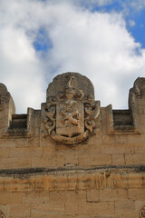 Fototapeta premium Coat of arms on the facade of the old Kurisov estate.