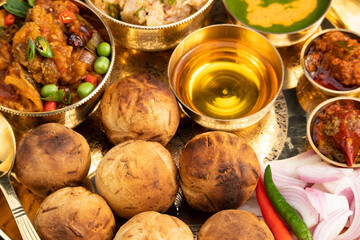 Regional Food Of Bihar Jharkhand And Uttar Pradesh UP. Litti Chokha Litty Stuffed With Chana Sattu Served With Alu Or Aloo Baingan Bharta Desi Ghee Lehsun Adrakh Lehsoon Chutney Achar And Pyaj Salad