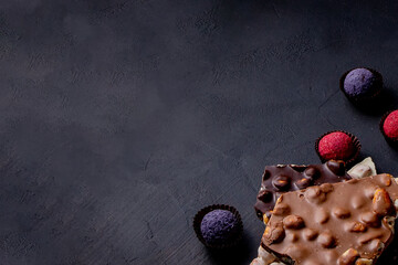 Chocolates background. Chocolate. Assortment of fine chocolates in white, dark, and milk chocolate....
