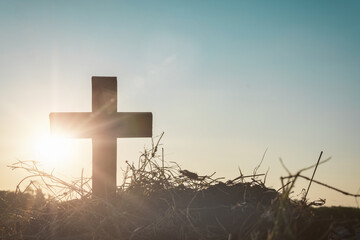 Silhouette jesus christ crucifix on cross on calvary sunset background concept for good friday he...