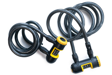 Two yellow and black bike locks with code to unlock isolated on a white background. Numbers. Coded. Security. Bicycle protection. Cable. Rope. Fastener. Unlock. Combination. Numbers