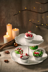 Christmas decoration on cupcakes, beautiful holiday background.
