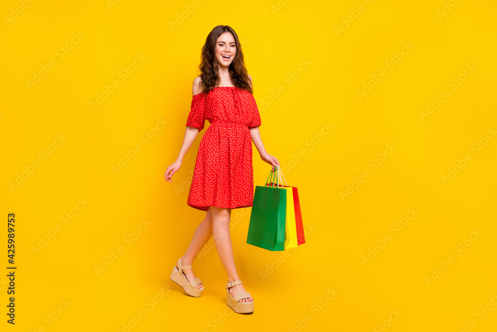 Poster Full body profile photo of cheerful person toothy smile have fun look camera isolated on yellow color background