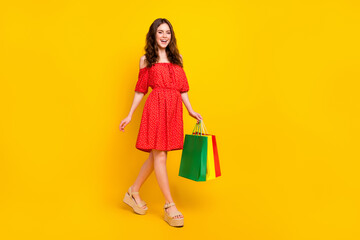 Full body profile photo of cheerful person toothy smile have fun look camera isolated on yellow color background