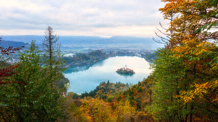 Famous alpine Bled lake (Blejsko jezero) in Slovenia, amazing autumn landscape. Scenic aerial view...