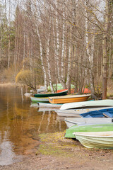Boats on the bank of Vuoksi river in spring, Imatra, Finland