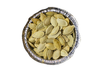 Pumpkin seeds in a cup of foil on a white background