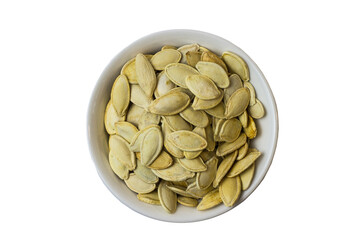 Pumpkin seeds in a white bowl on a white background