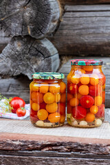 Tomatoes in a glass jar, homemade pickles