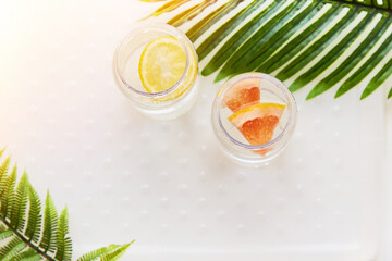 Hard seltzer with grapefruit and lemon. Homemade summer cocktails. Summer background,  copy space. Top view