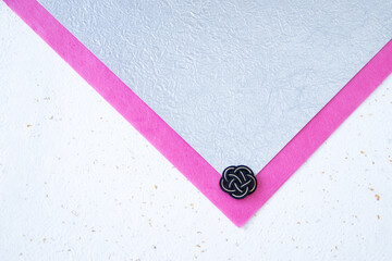 和紙と黒と金の水引のデザイン（ピンク、銀色、白）
