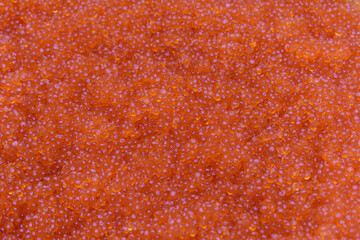 Red caviar for the backdrop. Caviar -  pink salmon, chum salmon, sockeye salmon, coho salmon,  trout.