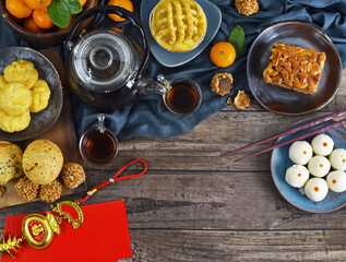 Fototapeta na wymiar Top view of accessories decorations and food for the Lunar new year festival